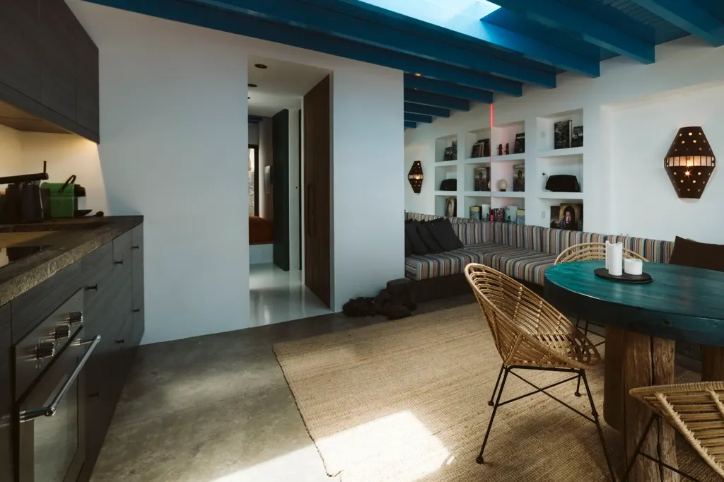 Living room with teal wooden ceiling beams